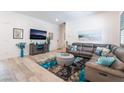 Cozy living room featuring a comfortable couch and stylish decor at 778 Dainty Daffodil St, Henderson, NV 89011