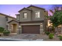 Two-story home with a two-car garage and low-maintenance landscaping at 8013 Green River Knob St, Las Vegas, NV 89113