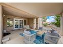 Covered patio with comfortable seating area, ideal for outdoor entertaining and relaxing at 8525 Festival Dr, Las Vegas, NV 89134