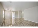 Bright living room featuring tile floors, neutral paint, and ample natural light at 9535 Golden Scots Ct, Las Vegas, NV 89123