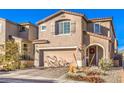 Charming two-story home showcasing a neat yard, brick driveway and a two-car garage at 10940 Oregano Ave, Las Vegas, NV 89166