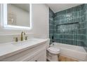 Stylish bathroom with new tub, tiled shower, and modern vanity and mirror at 1209 S 17Th St, Las Vegas, NV 89104