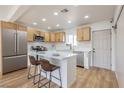 Updated kitchen featuring stainless steel appliances, a center island, and wooden cabinets at 1209 S 17Th St, Las Vegas, NV 89104