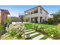 Spacious backyard features artificial grass, a basketball court, covered patio and a balcony at 12413 Alpenglow Ct, Las Vegas, NV 89138