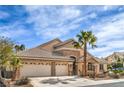 Charming single-story home featuring a three-car garage, desert landscaping, and a beautiful stone facade at 1532 Via Cassia, Henderson, NV 89052