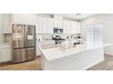 Modern kitchen featuring white cabinets, quartz countertops, and stainless steel appliances at 267 Cordelia Cove Ave # 812, Henderson, NV 89011