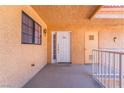 Condo entrance featuring textured walls, overhead lighting, and numbered door, providing a warm welcome at 2851 S Valley View Blvd # 2148, Las Vegas, NV 89102
