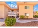 Exterior of condo featuring well-maintained landscaping and walkway on a sunny day at 2851 S Valley View Blvd # 2148, Las Vegas, NV 89102