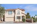 Charming two-story home featuring a well-manicured lawn and a two-car garage at 3194 Lapis Beach Dr, Las Vegas, NV 89117