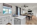 Modern kitchen with white countertops, stainless steel appliances, and backyard views at 3194 Lapis Beach Dr, Las Vegas, NV 89117