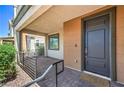 Charming front porch with stone pavers, accessible ramp, and modern front door entrance at 406 Gracious Way, Henderson, NV 89011