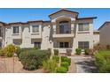 Elegant multi-story condo with a private balcony overlooking the meticulously landscaped grounds of the Painted Desert community at 4821 Black Bear Rd # 101, Las Vegas, NV 89149