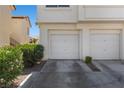 Attached garages of the Painted Desert condos with well maintained landscaping at 4821 Black Bear Rd # 101, Las Vegas, NV 89149