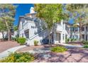 Well-maintained condo building with manicured landscaping and mature trees at 5217 Caspian Springs Dr # 101, Las Vegas, NV 89120