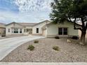Charming single-story home featuring a low-maintenance desert landscape and a paved driveway at 5422 Nestled Moon Ct, Las Vegas, NV 89131