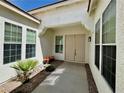 Welcoming front entrance with double doors, stylish lighting, and desert landscaping at 5422 Nestled Moon Ct, Las Vegas, NV 89131