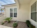 Nice single story home with desert landscaping and an iron security gate at the entrance at 5422 Nestled Moon Ct, Las Vegas, NV 89131