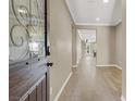 A bright and spacious entryway featuring hardwood floors, a decorative front door and neutral walls at 7428 Alamo Ranch Ave, Las Vegas, NV 89179