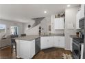 Open kitchen with island, granite countertops and stainless steel appliances at 7515 Emerald Stars St # 102, North Las Vegas, NV 89084