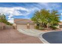 An angle side view showing a long drive and three car garage on a well maintained property at 8356 Shady Lady Ct, Las Vegas, NV 89131