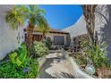 Inviting front entrance with lush landscaping and a charming walkway leading to the front door at 853 Morning Sun Ct, Las Vegas, NV 89110