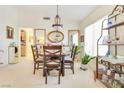Bright dining room featuring a round table with seating for four and decorative display shelves at 9921 Woodhouse Dr, Las Vegas, NV 89134