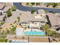 Aerial view of a beautiful home with a swimming pool, patio, and manicured landscaping at 12273 Catanzaro Ave, Las Vegas, NV 89138
