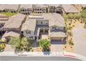 Gorgeous home featuring tile roofing, a front-facing garage, and a paved driveway and walkway at 12273 Catanzaro Ave, Las Vegas, NV 89138