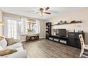Relaxing living room featuring wood floors, modern decor, and lots of natural light at 2040 Bavington Dr # D, Las Vegas, NV 89108