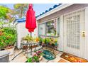 Charming patio area adorned with vibrant plants and flowers, perfect for outdoor relaxation at 2040 Bavington Dr # D, Las Vegas, NV 89108