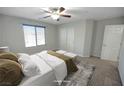 Neutral bedroom with cozy carpet, large window, and ample closet space at 2332 Mundare Dr, Henderson, NV 89002