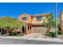 Two-story home showcasing an attached two-car garage, manicured landscaping, and covered front entryway at 2544 Sable Ridge St, Henderson, NV 89044