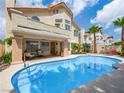 Private backyard oasis with a sparkling pool and covered patio, perfect for outdoor relaxation at 2736 Huber Heights Dr, Las Vegas, NV 89128