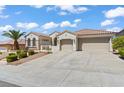 Beautiful single-story home showcasing a well-manicured lawn, palm tree, and convenient three-car garage at 2868 Foxtail Creek Ave, Henderson, NV 89052