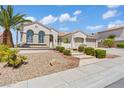 Lovely single-story house with a three-car garage, landscaped yard, and stone accents at 2868 Foxtail Creek Ave, Henderson, NV 89052