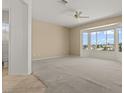 Bright main bedroom featuring large bay windows with views, and ensuite bathroom at 2868 Foxtail Creek Ave, Henderson, NV 89052