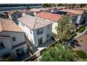Aerial view of a two-story home with a fenced yard and a neatly arranged neighborhood at 3120 Inlet Bay Ave, North Las Vegas, NV 89031
