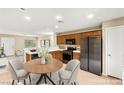 Eat-in kitchen features stainless steel appliances, wood cabinets, and an adjacent dining area at 3619 Hat Rock Ct, Las Vegas, NV 89129