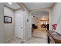 Bright entryway leading into a spacious home, featuring tile floors and neutral decor at 3712 Rocklin Peak Ave, North Las Vegas, NV 89081