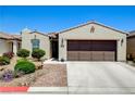 Inviting single-story home with landscaped front yard and brown two-car garage door at 3712 Rocklin Peak Ave, North Las Vegas, NV 89081