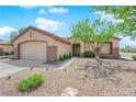 Attractive single-story home featuring a well-kept front yard, and a two-car garage at 439 Pelican Bay Ct, Henderson, NV 89012