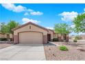 Charming single-story home with a well-maintained front yard and two-car garage at 439 Pelican Bay Ct, Henderson, NV 89012
