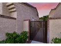 Charming courtyard gate with address plaque, offering privacy and curb appeal to this lovely property at 5142 Southern Hills Ln, Las Vegas, NV 89113