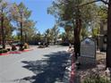 Community entrance with a decorative 'Montana' sign, trees, and gated access at 555 E Silverado Ranch Blvd # 2052, Las Vegas, NV 89183