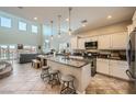 Open-concept kitchen with granite counters, stainless steel appliances and great natural light at 5662 Oak Bend Dr, Las Vegas, NV 89135