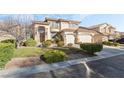 Attractive two-story home with a spacious three-car garage and meticulously maintained landscaping at 5684 Benevento Ct, Las Vegas, NV 89141