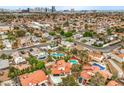 Panoramic aerial view of a residential neighborhood featuring homes with pools and well-maintained landscaping at 5757 Charles Holden Ct, Las Vegas, NV 89103