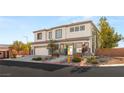 Beautiful two-story home with desert landscaping and a two-car garage on a sunny day at 6315 Bellisima St, Las Vegas, NV 89118