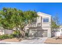 Attractive two-story home boasting a well-maintained lawn, inviting curb appeal and a two-car garage at 6649 Maple Mesa St, North Las Vegas, NV 89084
