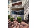 Lovely covered balcony area with an outdoor umbrella, perfect for enjoying relaxing outdoor living at 7400 W Flamingo Rd # 1090, Las Vegas, NV 89147